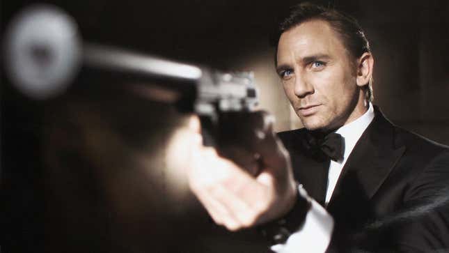 James Bond points a gun with a silencer.